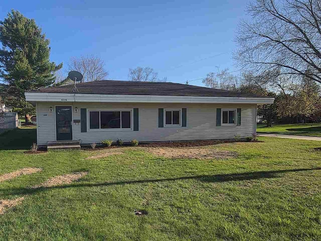 409 Trent St, Boyne City, MI 49712 - ranch-style home with a front lawn