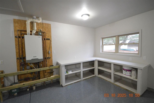 409 Trent St, Boyne City, MI 49712 - misc room featuring water heater and speckled floor