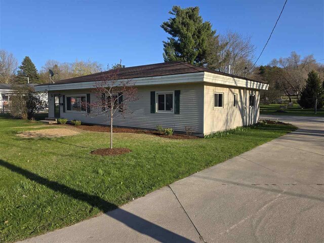 409 Trent St, Boyne City, MI 49712 - view of front of property with a front yard