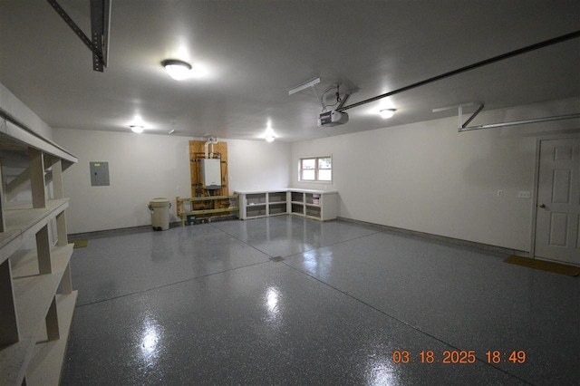 409 Trent St, Boyne City, MI 49712 - garage featuring a garage door opener, electric panel, and water heater