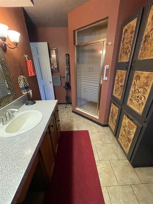 9690 Lake St, Ellsworth, MI 49729 - full bathroom featuring a shower stall, vanity, and tile patterned floors