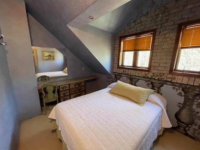 9690 Lake St, Ellsworth, MI 49729 - carpeted bedroom featuring vaulted ceiling