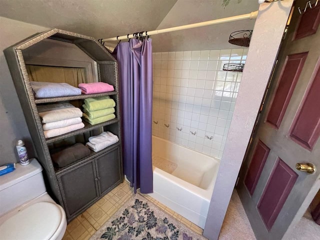 9690 Lake St, Ellsworth, MI 49729 - full bath with shower / tub combo with curtain, toilet, and tile patterned flooring