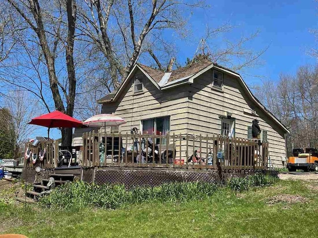 9690 Lake St, Ellsworth, MI 49729 - rear view of property featuring a wooden deck