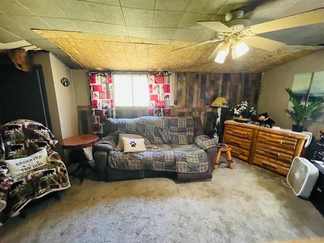 9690 Lake St, Ellsworth, MI 49729 - living room with carpet floors and a ceiling fan