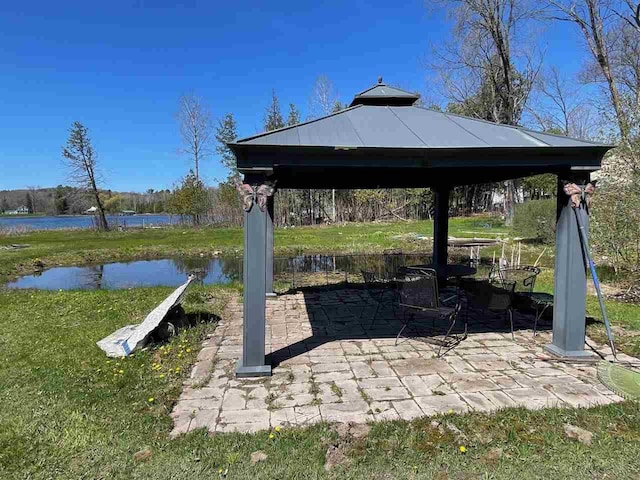 9690 Lake St, Ellsworth, MI 49729 - view of patio featuring a gazebo and a water view