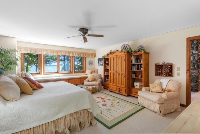 1442 Indian Point Rd, Brutus, MI 49716 - bedroom with light carpet and ceiling fan