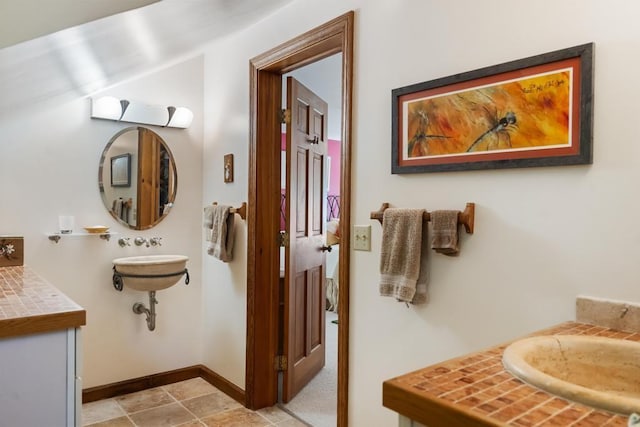 1442 Indian Point Rd, Brutus, MI 49716 - bathroom with baseboards and a sink