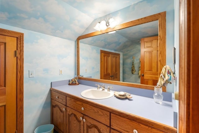 1442 Indian Point Rd, Brutus, MI 49716 - bathroom featuring lofted ceiling and vanity