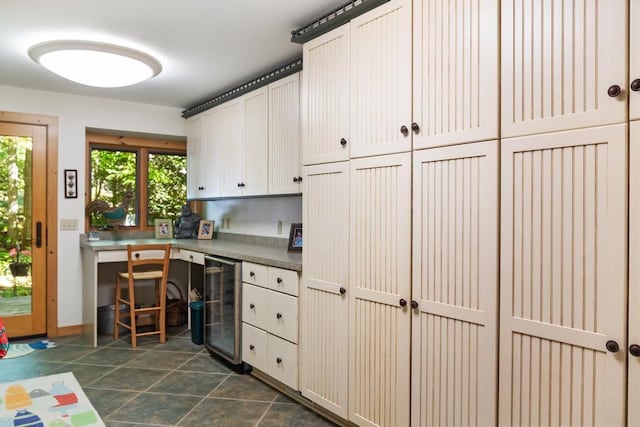 1442 Indian Point Rd, Brutus, MI 49716 - kitchen featuring beverage cooler and baseboards