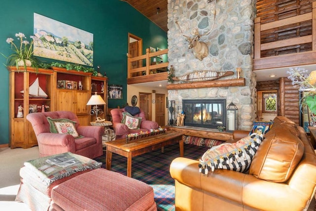 1442 Indian Point Rd, Brutus, MI 49716 - carpeted living area with high vaulted ceiling, a fireplace, and wooden ceiling