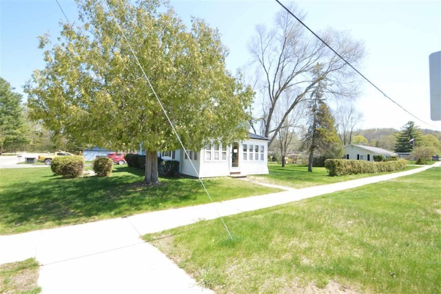 view of property exterior featuring a yard