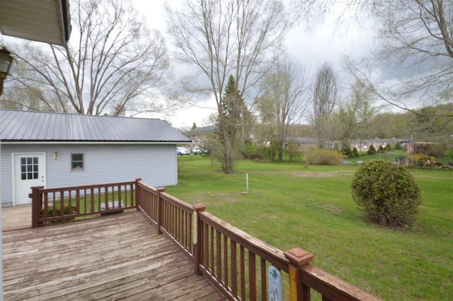 wooden deck with a lawn