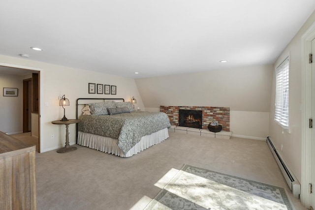 bedroom featuring a baseboard radiator, light carpet, recessed lighting, a brick fireplace, and baseboards