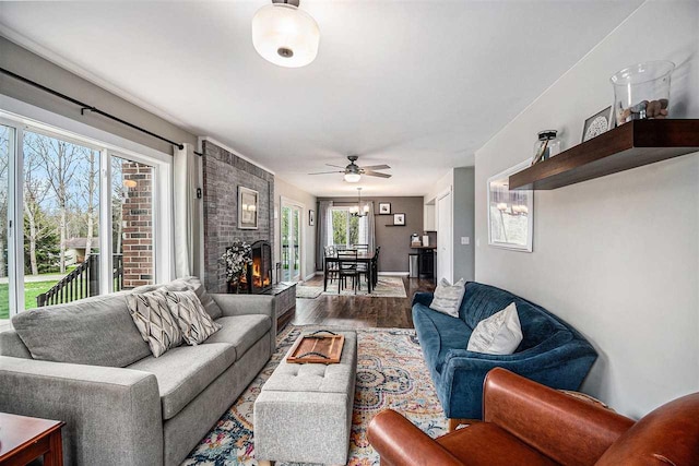 3190 Spring Dr, Boyne Falls, MI 49713 - living room featuring wood finished floors, ceiling fan, and a fireplace