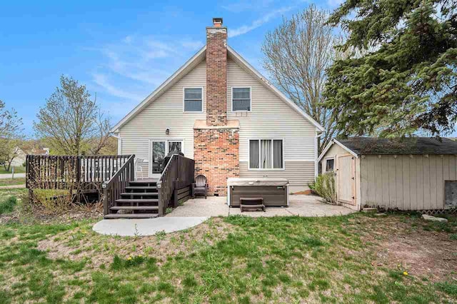 3190 Spring Dr, Boyne Falls, MI 49713 - rear view of house featuring a hot tub, a storage shed, a deck, a chimney, and a patio area
