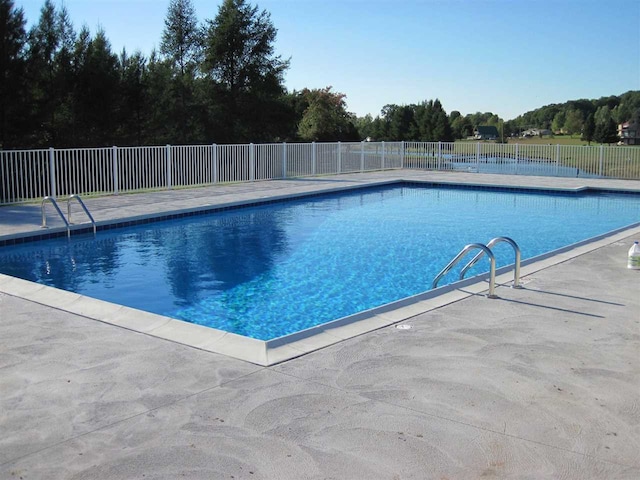 3190 Spring Dr, Boyne Falls, MI 49713 - view of swimming pool with fence