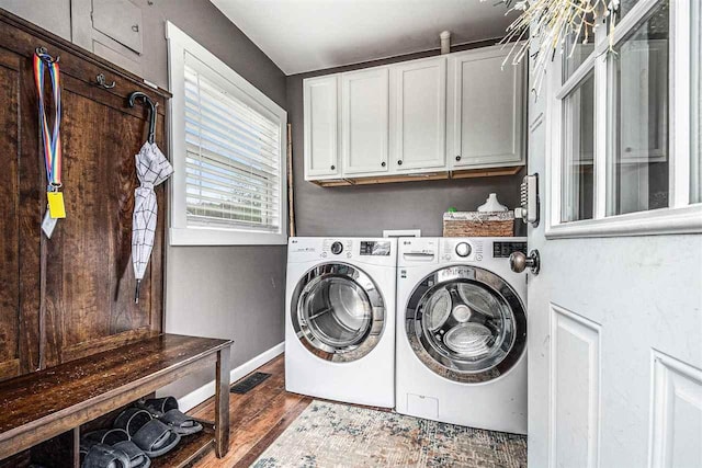 3190 Spring Dr, Boyne Falls, MI 49713 - washroom featuring cabinet space, washer and clothes dryer, dark wood-style floors, and baseboards