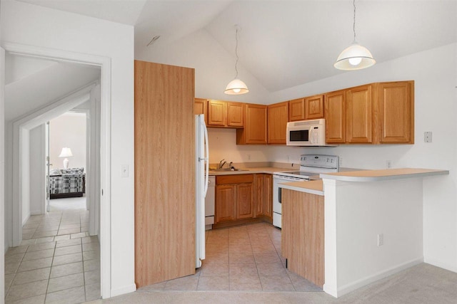 4070 Carriage House Dr Unit 5 & 6, Bay Harbor, MI 49770 - kitchen with white appliances, light countertops, a peninsula, light tile patterned floors, and a sink