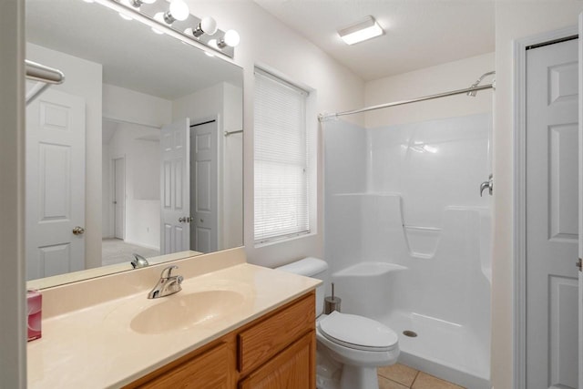 4070 Carriage House Dr Unit 5 & 6, Bay Harbor, MI 49770 - bathroom with a shower, tile patterned floors, toilet, and vanity