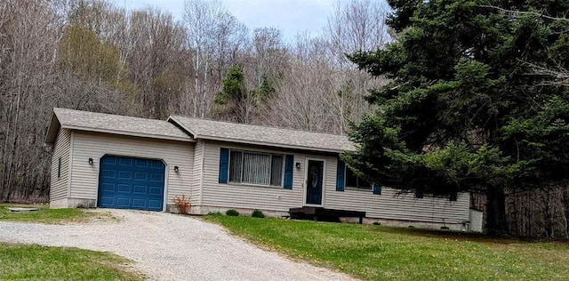 2280 S Eckhardt Rd, Bellaire, MI 49615 - single story home featuring an attached garage, driveway, entry steps, a front yard, and roof with shingles