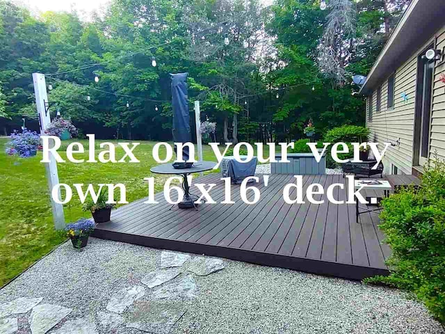 2280 S Eckhardt Rd, Bellaire, MI 49615 - deck with a lawn