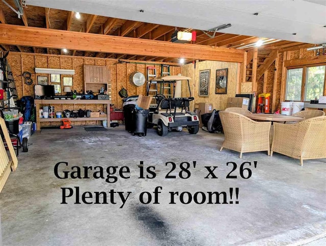 5350 Golfview Rd, Bellaire, MI 49615 - garage featuring a garage door opener