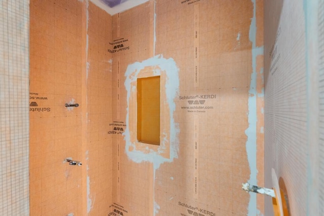 bathroom with tiled shower