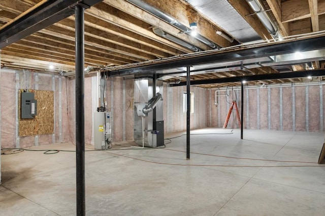below grade area featuring electric panel, gas water heater, and heating unit