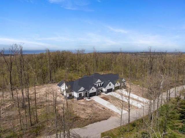 view of subject property with a forest