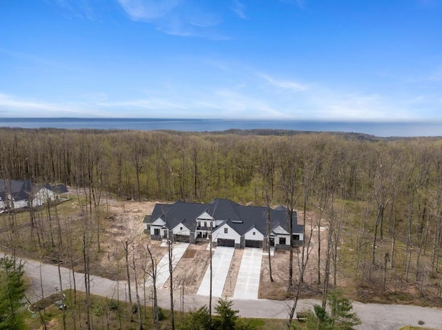 view from above of property featuring a heavily wooded area