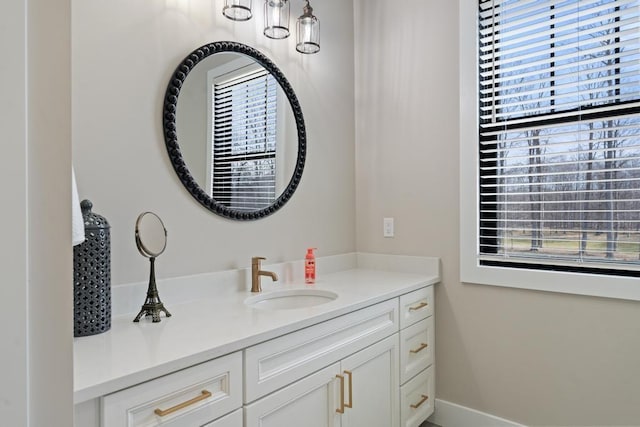 bathroom with vanity and baseboards