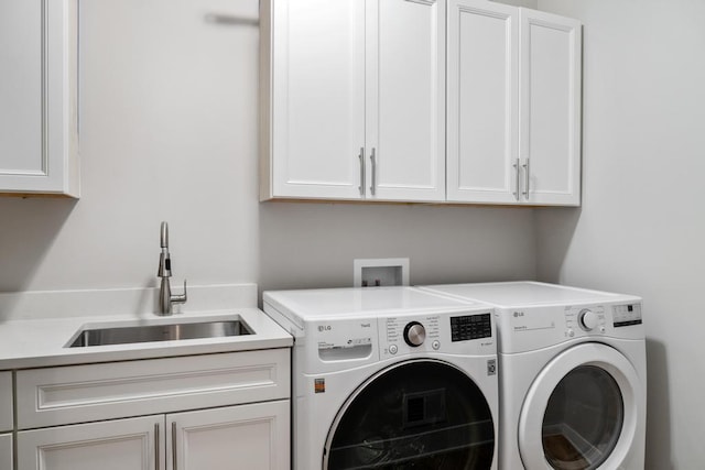 laundry area featuring cabinet space and washer and clothes dryer