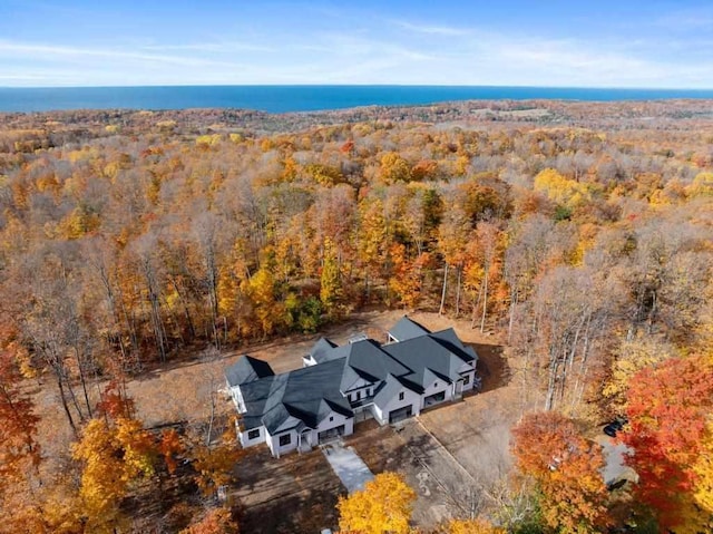 view of subject property featuring a heavily wooded area