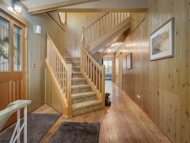 998 N Shr, Walloon Lake, MI 49796 - stairway featuring wooden walls and hardwood / wood-style flooring