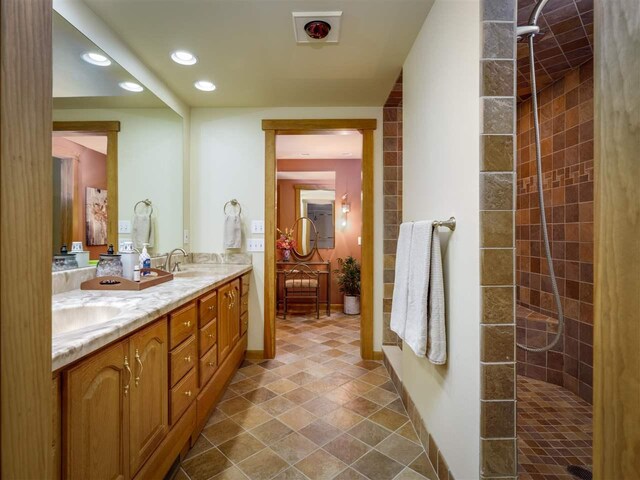 998 N Shr, Walloon Lake, MI 49796 - full bathroom with double vanity, recessed lighting, and a walk in shower