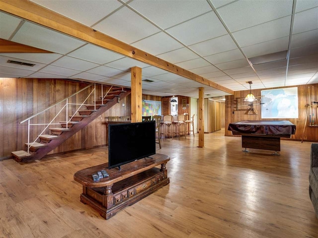 998 N Shr, Walloon Lake, MI 49796 - game room with wood walls, pool table, a paneled ceiling, wood finished floors, and bar area