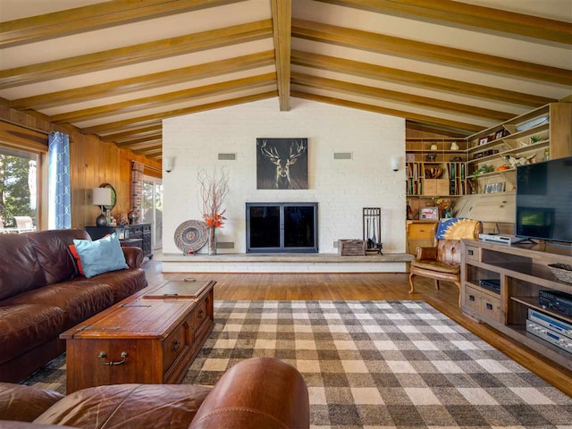 998 N Shr, Walloon Lake, MI 49796 - living area with a glass covered fireplace and wood finished floors