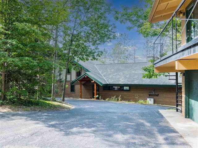 998 N Shr, Walloon Lake, MI 49796 - view of front of property with roof with shingles