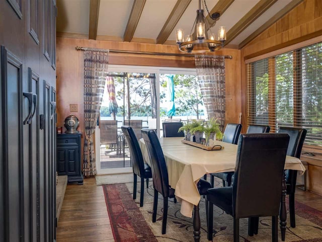 998 N Shr, Walloon Lake, MI 49796 - dining room featuring a chandelier, plenty of natural light, wood finished floors, and wooden walls