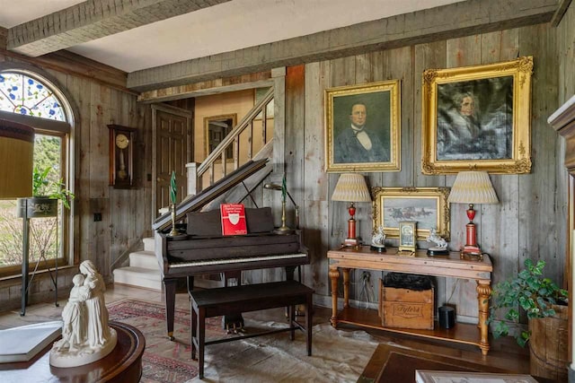110 Birchwood Dr, Harbor Springs, MI 49740 - sitting room featuring stairway, wood walls, plenty of natural light, and beamed ceiling