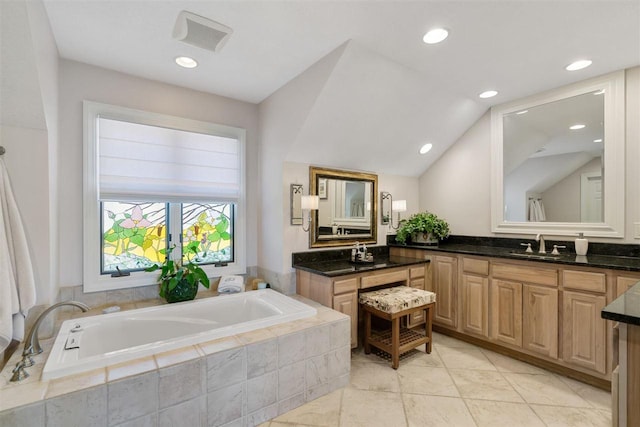 110 Birchwood Dr, Harbor Springs, MI 49740 - bathroom with a garden tub, vanity, lofted ceiling, and recessed lighting