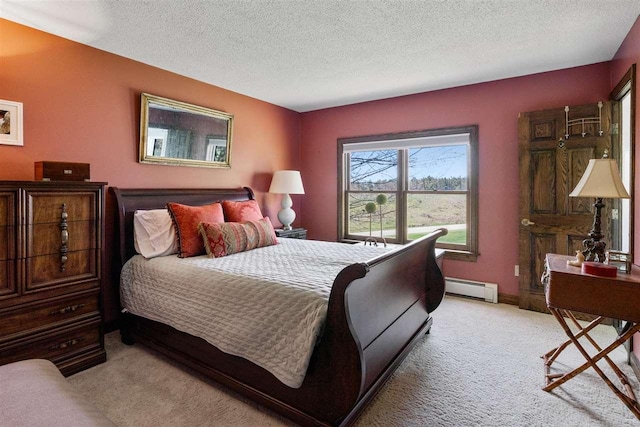 110 Birchwood Dr, Harbor Springs, MI 49740 - bedroom with light carpet, baseboard heating, and a textured ceiling