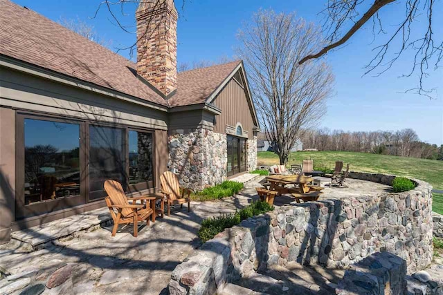 110 Birchwood Dr, Harbor Springs, MI 49740 - view of patio / terrace featuring an outdoor fire pit
