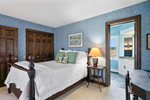 110 Birchwood Dr, Harbor Springs, MI 49740 - bedroom featuring carpet flooring, wallpapered walls, and a baseboard heating unit