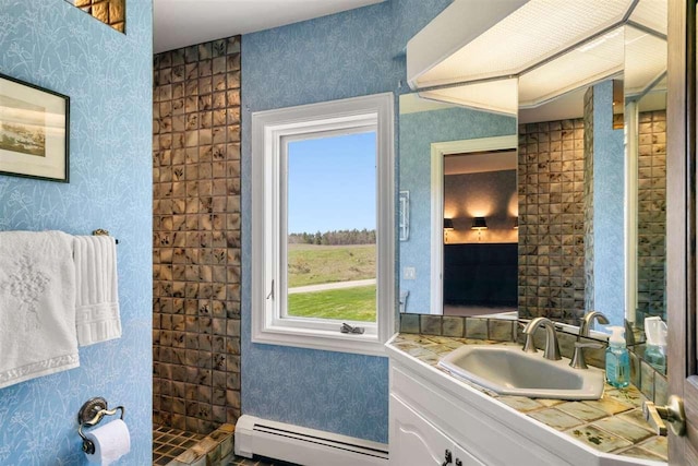 110 Birchwood Dr, Harbor Springs, MI 49740 - full bathroom with a baseboard radiator, wallpapered walls, vanity, and tiled shower