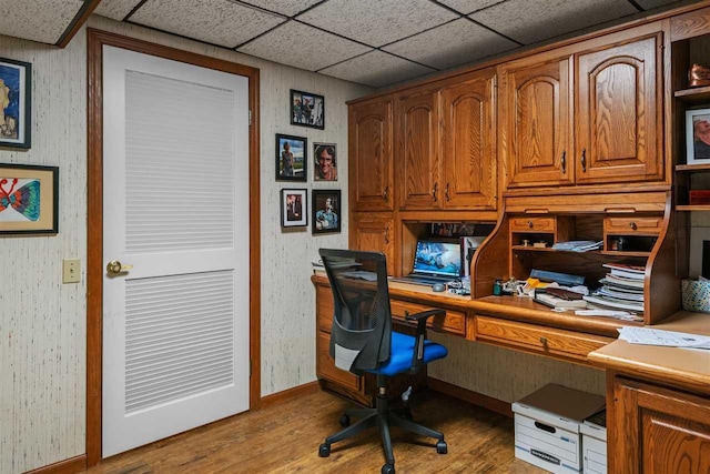 110 Birchwood Dr, Harbor Springs, MI 49740 - home office with light wood finished floors, baseboards, and built in desk