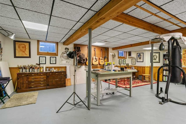 110 Birchwood Dr, Harbor Springs, MI 49740 - workout room featuring a drop ceiling, a wainscoted wall, and wood walls