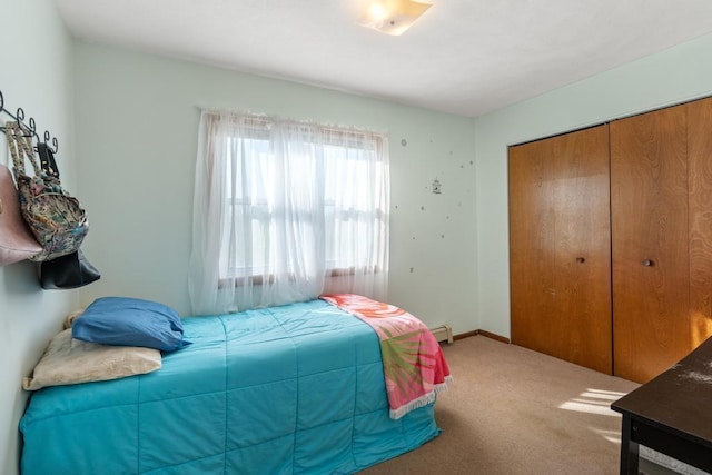 6141 S Old 31, Charlevoix, MI 49720 - carpeted bedroom with a closet and a baseboard radiator
