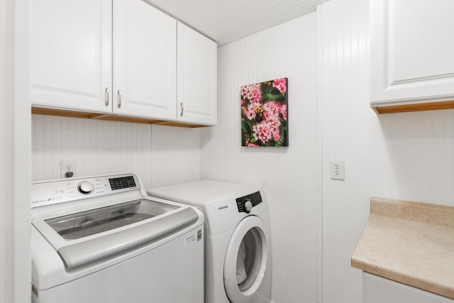 6141 S Old 31, Charlevoix, MI 49720 - laundry area featuring washer and dryer and cabinet space